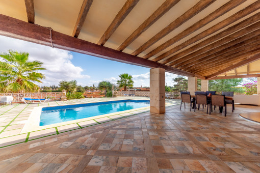 Large covered terrace with pool view