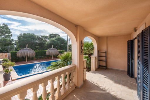 Sunny terrace with pool views