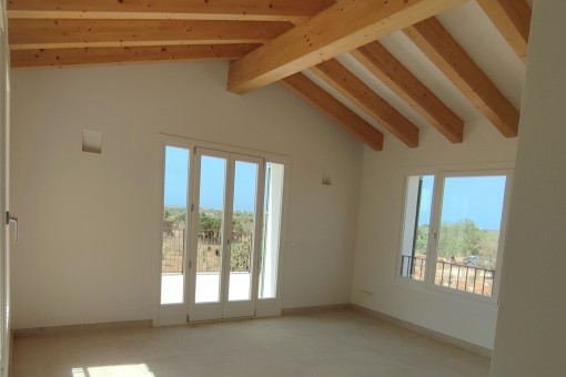 Bedroom with wooden ceiling beams