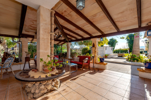 Covered terrace with various seating areas