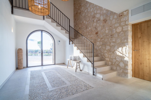 Impressive hall with natural stone wall