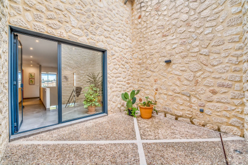 Patio with natural stone wall