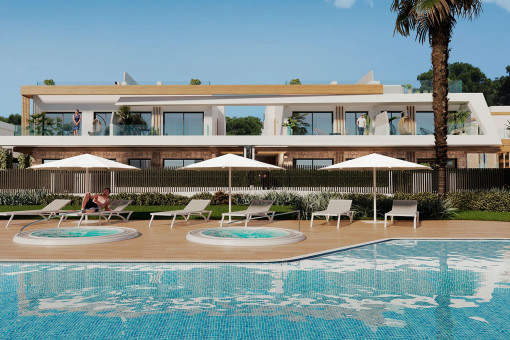 Community pool area with sun loungers