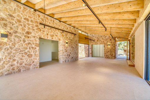 Living and dining area with wooden beams