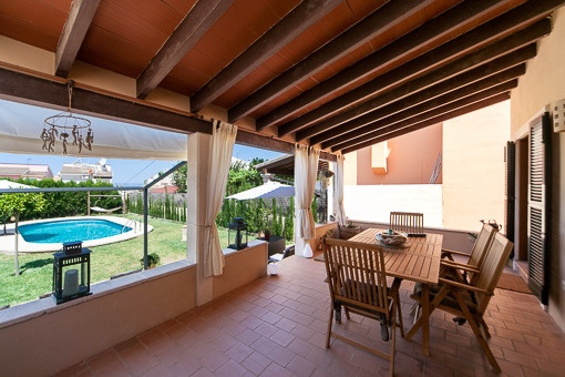 Covered terrace with garden views