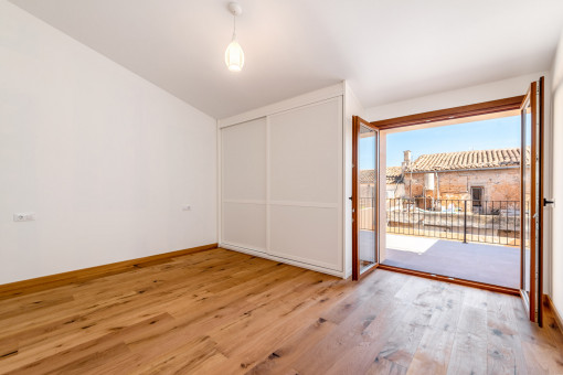 Main bedroom with balcony access