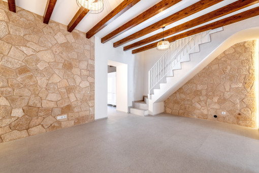 Cozy living area with natural stone wall