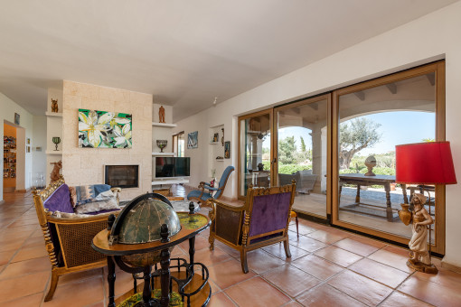 Living area with fireplace and terrace access