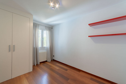 Another bedroom with built-in cupboards
