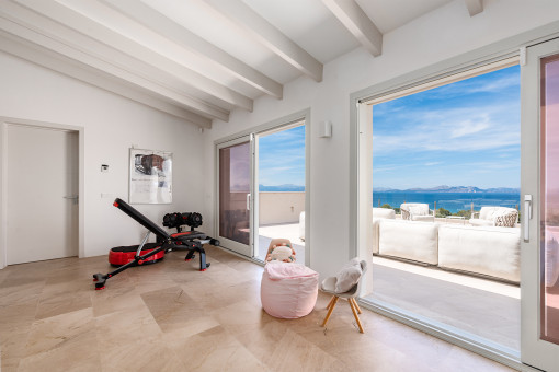 Gym/Upper room with sea views
