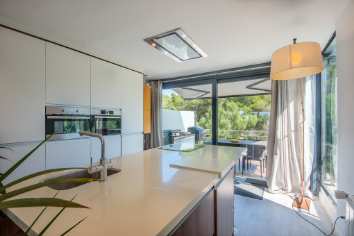 Kitchen with island and access to a terrace