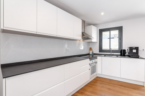 Fully equipped kitchen in white