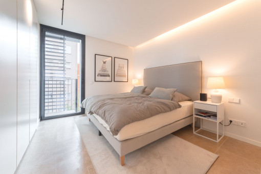 Bedroom with floor to ceiling windows