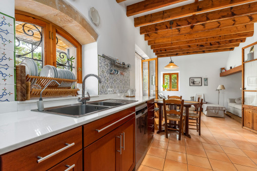 View to a dining table and further living room
