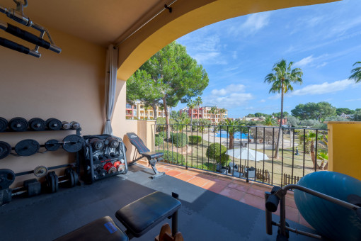 Covered terrace overlooking the community garden and pool