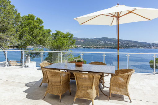 Sunny terrace with outdoor dining area