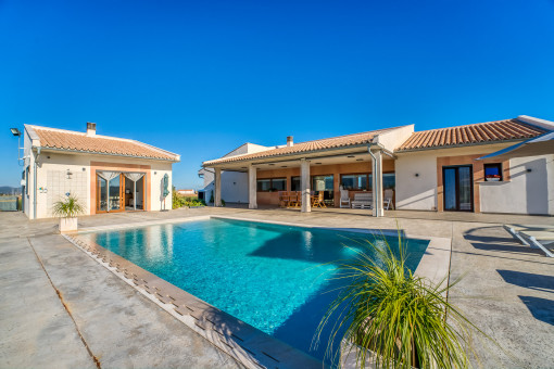 Pool area and frontal view to the property