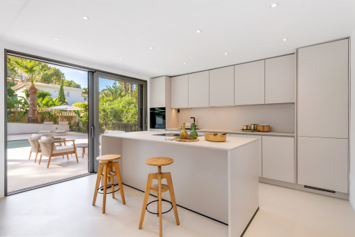 Open-plan kitchen with terrace access