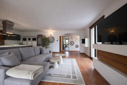 Open-plan living room with access to the terrace