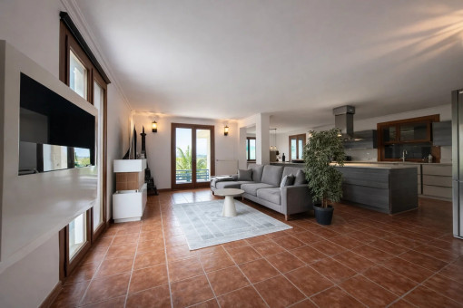 Living area with open, modern kitchen