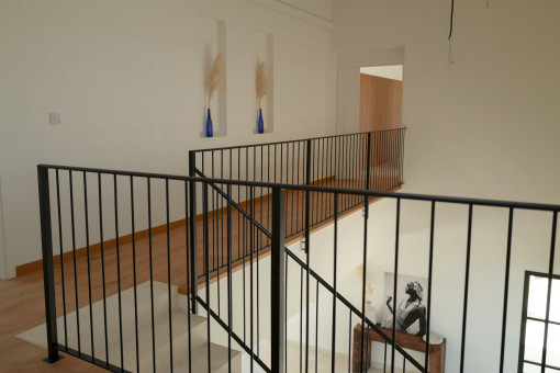 Staircase and upper-floor hallway