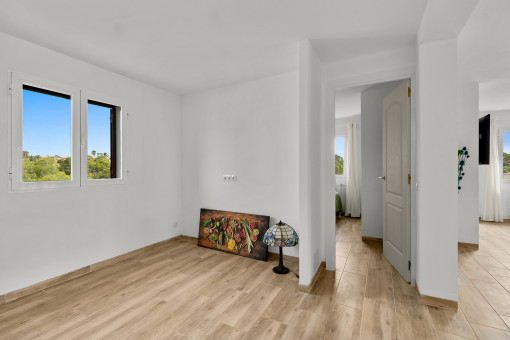 Open kitchen area adjacent to living area on the upper floor