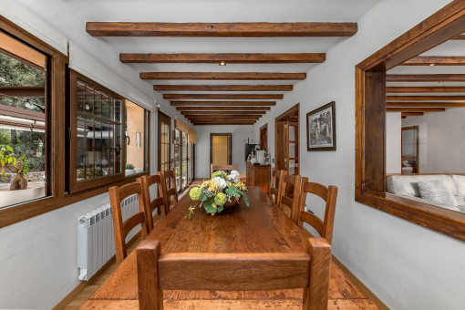 Bright dining room with wooden beam ceiling