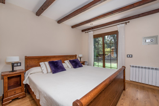 Third bedroom with natural light and wooden ceiling
