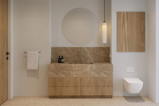 High-end en-suite bathroom with natural stone