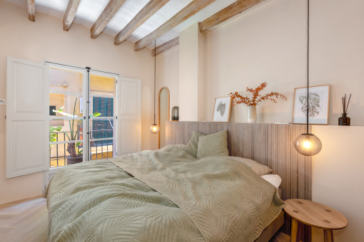 Master bedroom with original ceiling beams