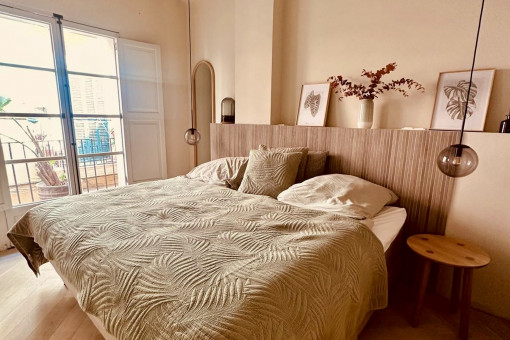 Master bedroom with original ceiling beams