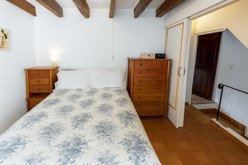 Cozy master bedroom with wooden furniture