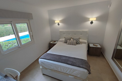  Bright bedroom with garden and pool views