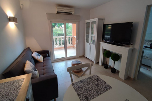 Living room with access to the covered terrace and garden