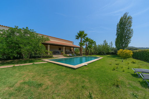 Mediterranean garden with pool and covered terrace