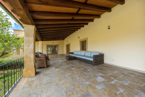 Upper balcony with lounge furniture and garden view