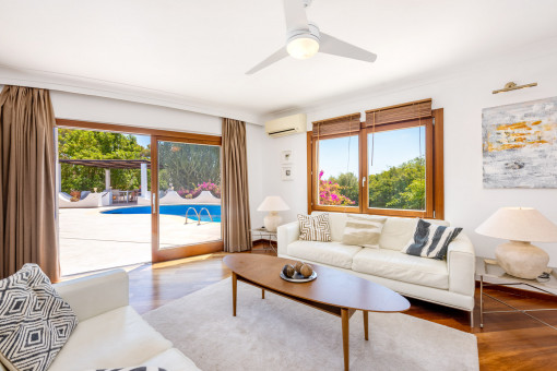 Bright living area with access to the pool terrace