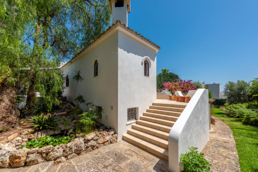 Rear side of the house with staircase leading to the pool terrace