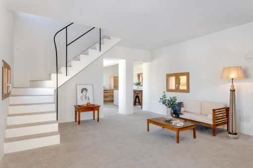 Open-plan living area with the kitchen in the background