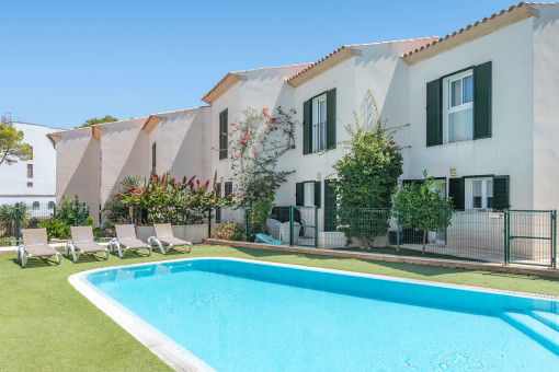 Community pool with sunbeds