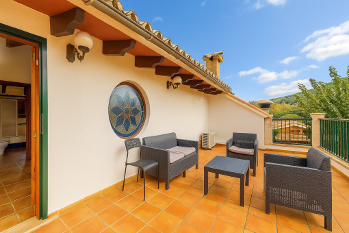 Terrace with seating area on the upper floor