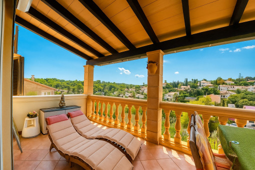 Covered terrace with dining area upstairs