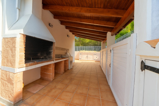 Covered BBQ area with storage