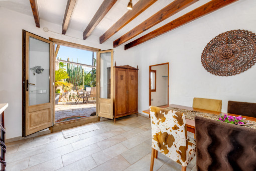 Dining area with exposed wooden beams