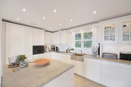 Stylish cooking island in bright, open kitchen