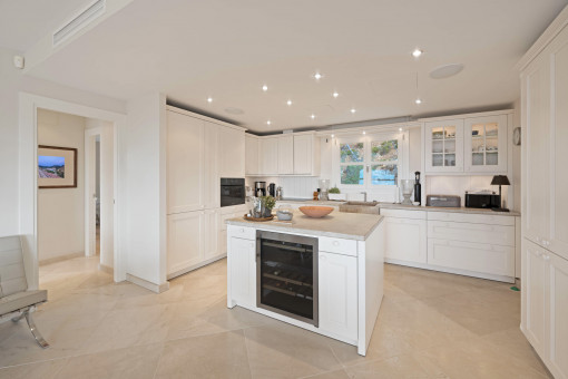Open kitchen with cooking island and integrated wine fridge