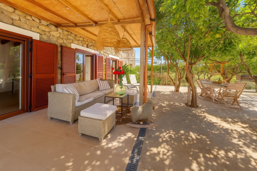 Covered terrace with seating areas