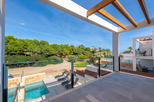 Modern exterior with pool area and lounge space