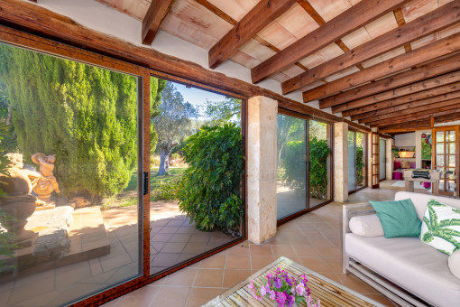 Conservatory with views of the garden and pool