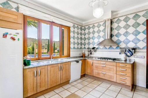 Spacious kitchen with views to the pool